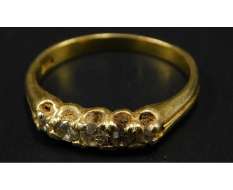 A five stone diamond dress ring, set with five claw set tiny diamonds, in a yellow metal setting, marked 18ct, 2.8g all in. 