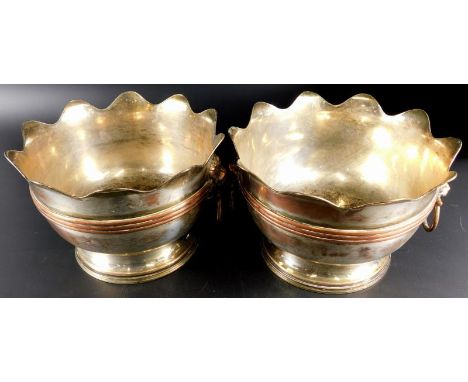 A pair of early 20thC electroplated monteith bowls, each with flared rims, lion mask ring handles, circular bodies with raise