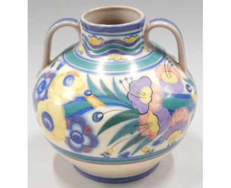 A Carter Stabler and Adams Poole pottery two handled vase, decorated with a band of brightly coloured flowers, impressed mark