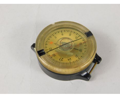 A German Luftwaffe Bakelite wrist compass, stamped to the reverse AK9, FL23235-1.