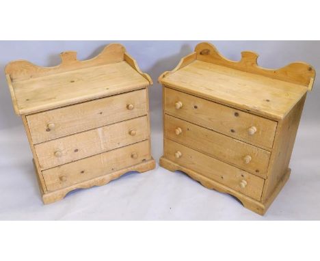 An unusual pair of small pine chest of drawers, each with a raised gallery and three drawers, on bracket feet, 70cm wide.