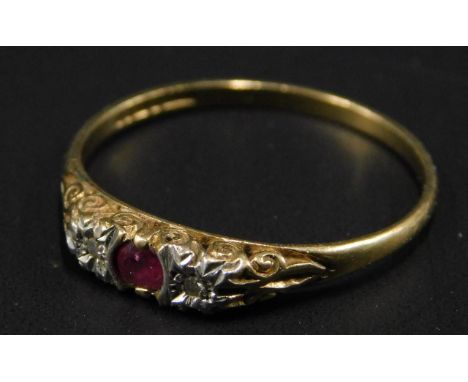 A 9ct gold dress ring, set with central red stone, flanked by two white stones, 1.3g all in. 