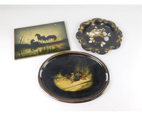 A Russian Toleware oval tray, painted with a winter scene and a Troika, a Russian signed papier mache panel painted in silhou