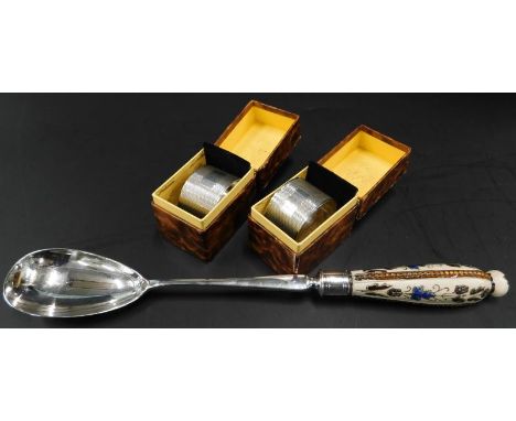 A pair of engine turned D-shaped napkin rings, each with a vacant cartouche, and a fitted case, Birmingham 1971, and a Royal 