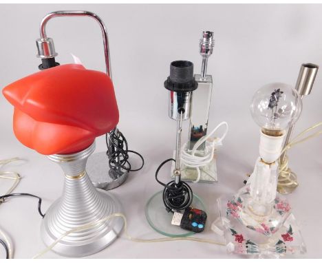 A modern table lamp, the shade modelled in the form of a pair of lips and a perspex table lamp decorated with flowers, a mirr