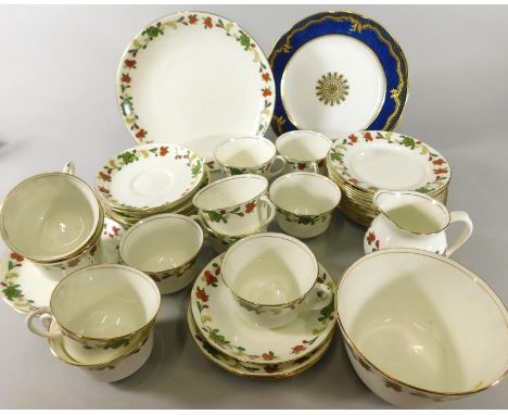 An Aynsley part tea service, decorated with flowers, scrolls etc., and a pair of Aynsley dessert plates with a mottled blue g