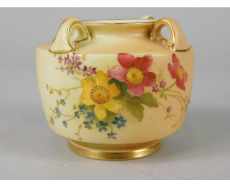 A Royal Worcester porcelain four handled squat vase, painted with flowers on a blush ivory ground, printed mark to underside 