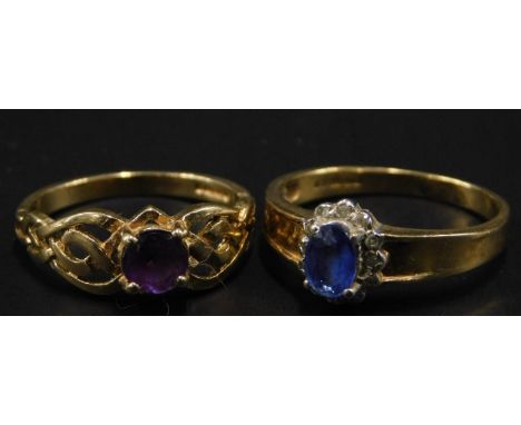 Two 9ct gold dress rings, to include a floral cluster set with white and blue stones, and an amethyst set dress ring, 4.2g al