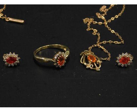 A fire opal and diamond jewellery set, to include a dress ring, a pair of cluster earrings and a pendant and chain, with orig