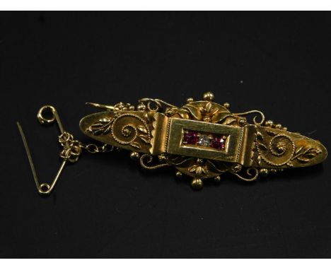 A 15ct gold bar brooch, set with central ruby and diamond, with design bar, 4.8g all in. 