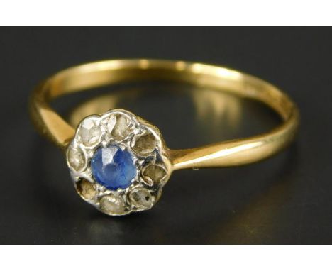 A Victorian 18ct gold sapphire and diamond floral cluster ring, with central pale blue sapphire, surrounded by eight diamonds