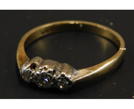 A three stone diamond dress ring, set with three illusion set tiny diamonds, yellow metal, marked but rubbed, 1.8g all in. 
