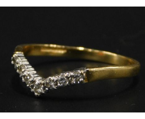 An 18ct gold wishbone ring, set with seven tiny diamonds, 1.8g all in. 