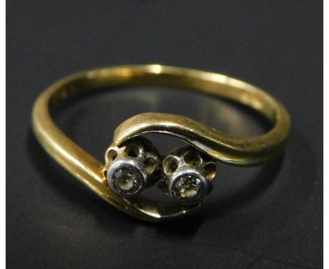 An 18ct gold dress ring, of twist design ring, set with two tiny diamonds, 2.4g all in. 