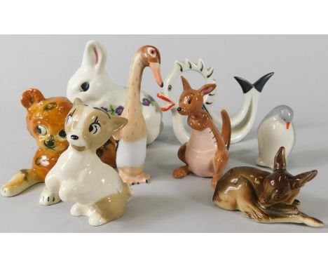A collection of ceramic animals, to include a Poole rabbit, decorated with purple flowers, Walt Disney Beswick Winnie the Poo