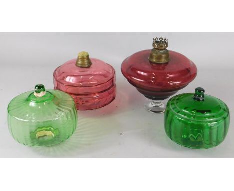 Four Victorian coloured oil lamp reservoirs, to include two cranberry tinted examples and two green