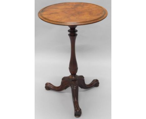 A Victorian mahogany occasional table, the circular top with a moulded edge on turned column and carved tripod base, 47cm dia