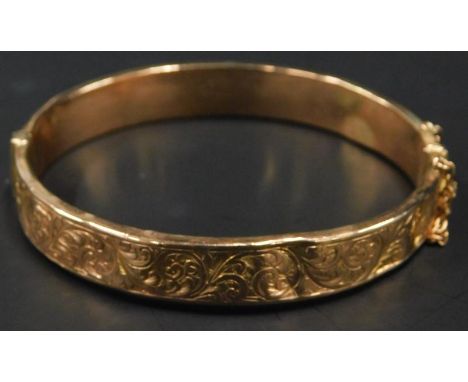 A 9ct gold bangle, with floral design to top half, (AF), 11.3g all in. 