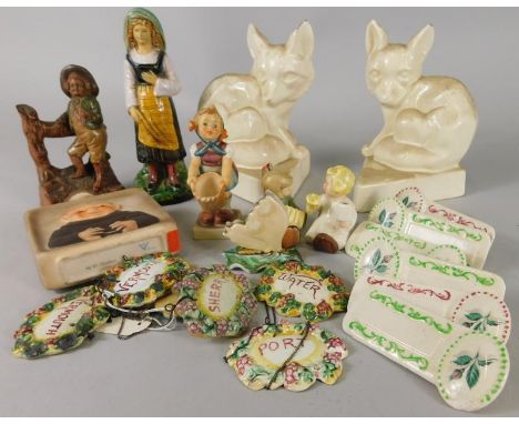 A collection of Continental ceramics, to include Goebel figures, a pair of fox bookends, decanter labels etc.