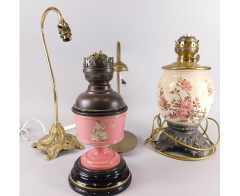 Various lamp bases, to include a Victorian oil lamp printed and painted with flowers, a green ceramic oil lamp decorated with