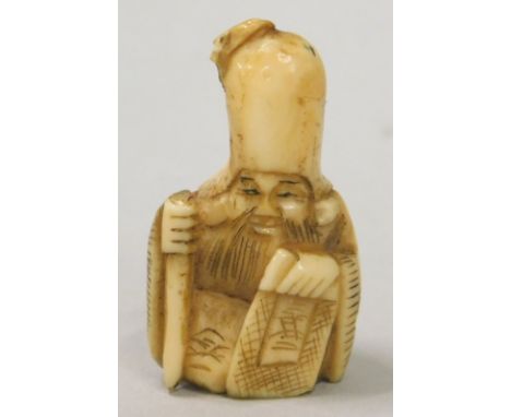 An early 20thC Japanese ivory netsuke, carved in the form of an immortal (AF)