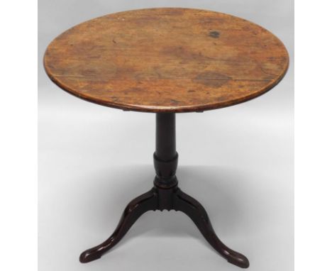 A George III mahogany occasional table, the circular tilt top on a turned column and tripod base, 67cm diameter