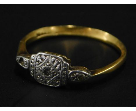 An Art Deco dress ring, with platinum design head and shoulders, set with white stones (one missing), on a yellow metal band,