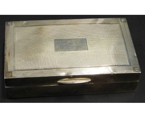 A small early 20thC silver mounted cigarette box, with engine turned decoration, Birmingham Assay date letter indistinct, loa