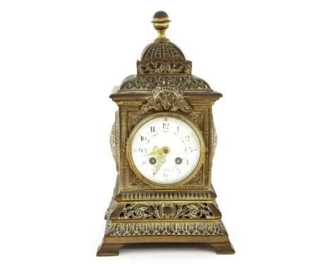 A mantel clock,late 19th century, the French movement to an enamel dial, within an ornate brass case,20cm wide20cm deep36cm h