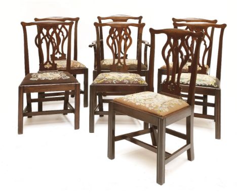 A set of eight Chippendale-style mahogany dining chairs, late 19th century, with pierced baluster shaped splats, drop-in tape