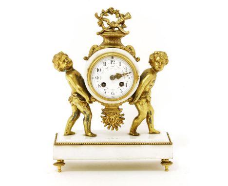 A French white marble and gilt spelter mantel clock,19th century, the drum movement with a painted dial, signed 'J. Januel', 