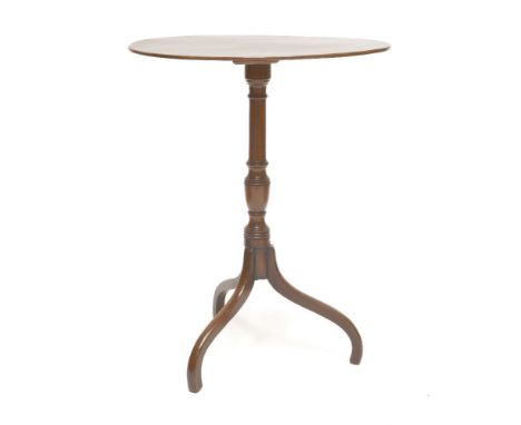 A mahogany tripod table,19th century, the oval top and turned column on downswept legs,57cm wide74cm high