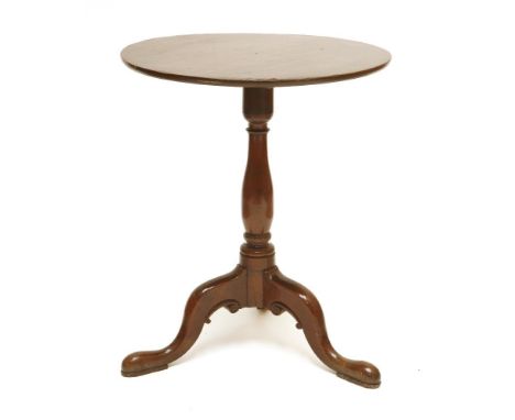 A George III mahogany tripod table,the circular top on a baluster column and outswept legs,59cm diameter70cm high