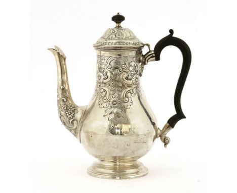 A late Victorian silver coffee pot,by Fordham &amp; Faulkner, Sheffield 1900, in the mid-18th century style, embossed and cha