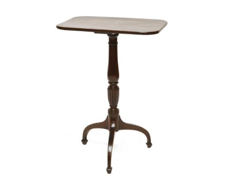 A George III mahogany tripod table,the rectangular top on a turned column and downswept legs,top 54 x 37cm76cm high