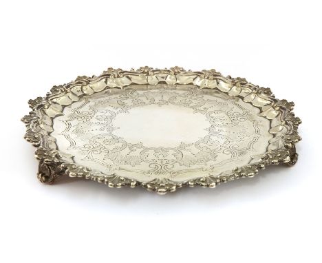 A Victorian silver salver,maker's mark 'SS', possibly Samuel Saltmarsh, London 1853, of shaped circular outline with a scroll