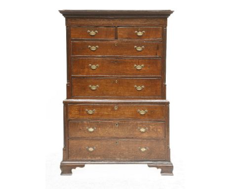 A George III oak chest on chest,with two short and six long drawers within quarter turned reeded columns on bracket feet,111c