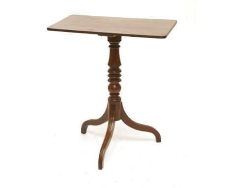 A Regency mahogany tripod table,the rectangular top with a reeded edge on a turned column and downswept supports,top 63 x 39c