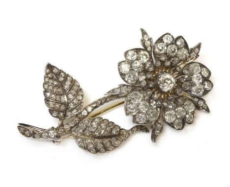 A Victorian diamond set floral en tremblant spray brooch,a flower head cluster with an old European cut diamond, in a cut dow