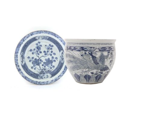 A Chinese blue and white planter,19th century, of tapering form, painted with phoenixes amongst peony between key fret and ba