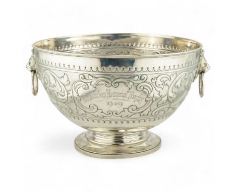 'H.A.Starkey Memorial Trophy 1949' - A silver rose bowl with lion mask ring handles and embossed floral decoration on short p