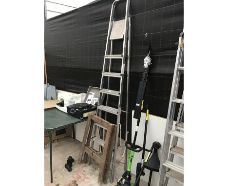 AN ALUMINIUM SEVEN RUNG STEP LADDER AND A WOODEN TRESTLE 