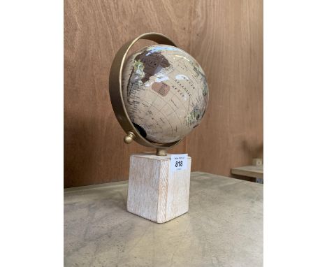 A MODERN DESK GLOBE ON WOODEN BLOCK STAND 