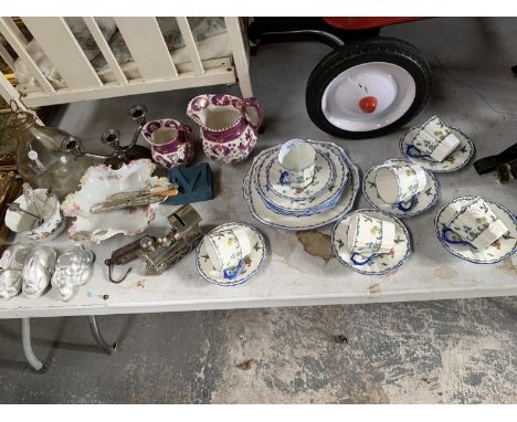AN ASSORTED COLLECTION OF CERAMICS TO INCLUDE CUPS,SAUCERS AND JUGS TOGETHER WITH CANDLE STICKS ETC 