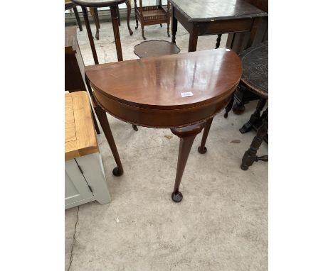 A SMALL DEMI LUNE MAHOGANY FOLDING CARD TABLE 