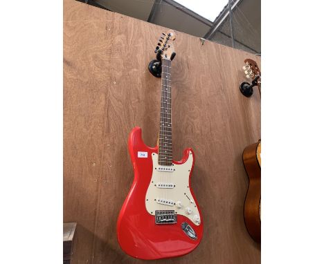 A CRUISER RED FENDER STYLE ELECTRIC GUITAR WITH AMPA ROCK GUITAR CD 