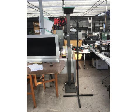 AN INDUSTRIAL STYLE STANDARD LAMP AND A BLACK HAT STAND 
