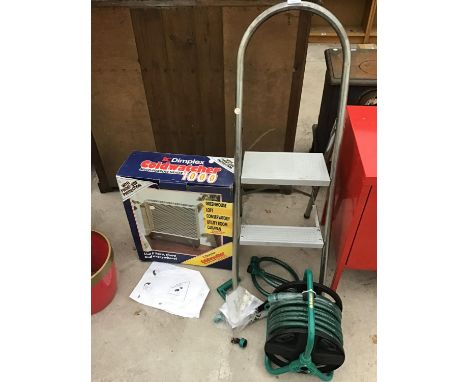A TWO STEP LADDER A HOSEPIPE ON REEL AND A COLDWATCHER 1000 HEATER 