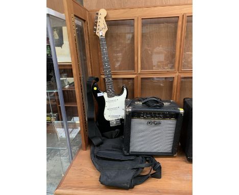 A FENDER SQUIRE BLACK ELECTRIC GUITAR WITH AMP, BAG AND STRAP 