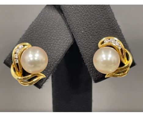 Pair of 18ct gold Pearl Diamond stud earrings. Approx .10cts